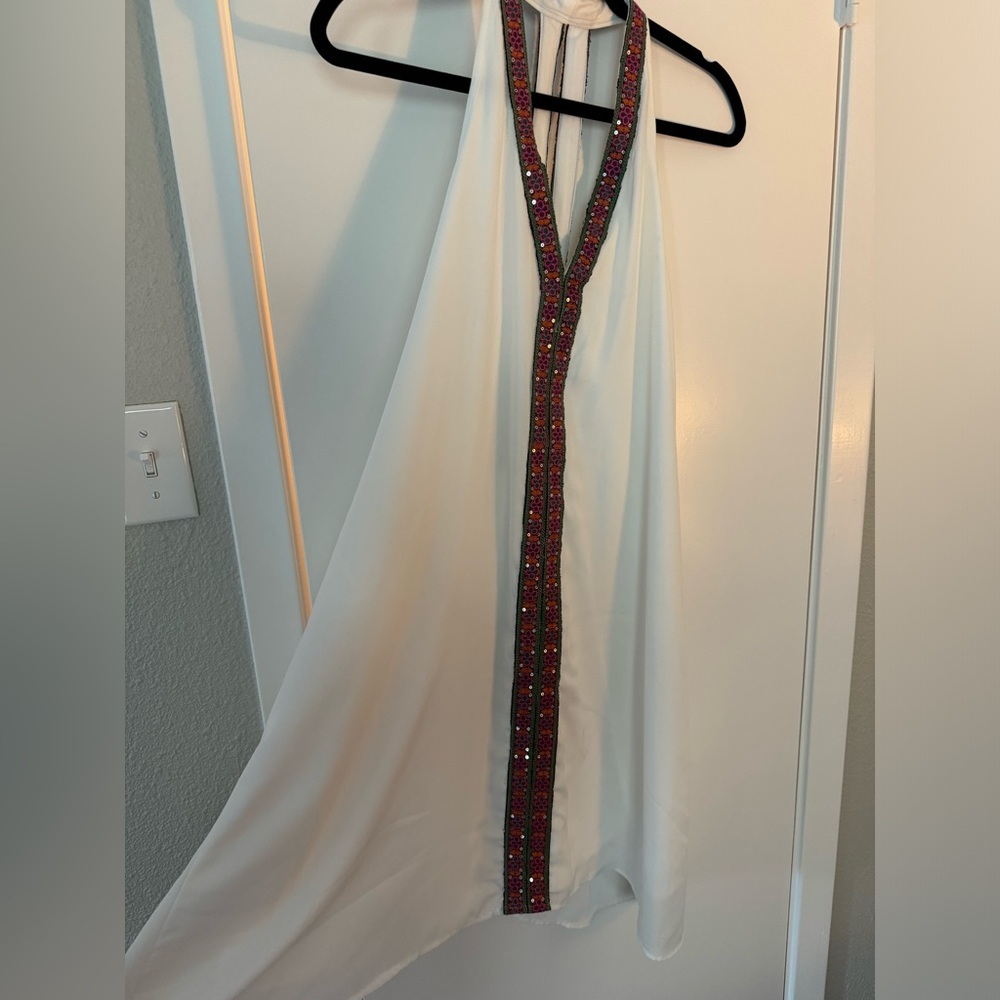 White dress with multicolored details. New with tags. Size large.
